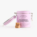 Cartwright & Butler Strawberry & Cream Fudge pastel pink clip-top tin shown open with fudge cubes in front.