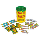 A yellow plastic barrel labelled "Toxic Waste" with "Hazardously Sour Candy" contains various colourful, individually packaged sour candies scattered around it. A yellow plastic barrel labelled "Toxic Waste" with "Hazardously Sour Candy" contains various colourful, individually packaged sour candies scattered around it.