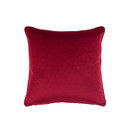 Reverse side of the cushion in plain red velvet fabric with a smooth finish.