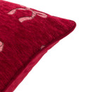 Side close-up of the red cushion, highlighting the textured fabric and neat piped edging.