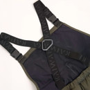 Dark suspenders with a geometric pattern, attached to the back of a pair of olive green pants. The background is plain white, highlighting the contrast.