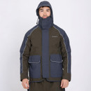 A person wearing a two-tone, hooded winter jacket with a high collar. The jacket is navy and dark green with white piping, conveying warmth and functionality.