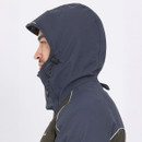 A person in profile wearing a dark hooded jacket. The hood covers most of their head, and they have a neutral expression. The background is plain white.