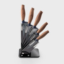A view of a 5-piece knife set and block on a white background