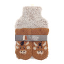 A hot water bottle and sock set featuring a cream fluffy cover for the bottle and a pair of brown cosy socks with a cute highland cow face design. The set is packaged with a grey belly band label reading “Country Club Hot Water Bottle & Sock Set.”