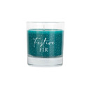 Green candle in a clear glass holder featuring the words "Festive Fir" with a white dotted snowflake design.