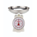 A view of a traditional cream weighing scale on a white background