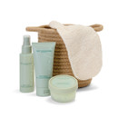 Body Collection England Awaken Body Glow Set including body mist, body wash, shea sugar scrub and exfoliating mitt, presented with a natural woven basket.