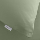 A close up view of a green pillow case