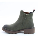 A side view of a green Heavenly Feet Chelsea ankle boot on a white background