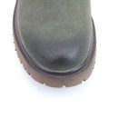 A close up view of a green Heavenly Feet Chelsea ankle boot on a white background