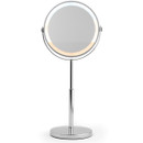 Round LED vanity mirror on a chrome stand, with a simple and elegant design. The mirror has an illuminated border, conveying a modern feel.