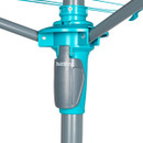 Close-up of a turquoise and gray rotary clothes airer mechanism, showing intersecting arms and a central pole. The branded name is visible.