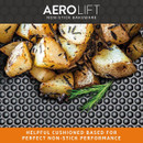 AeroLift cushioned non-stick base roasting tin with golden roasted potatoes and herbs