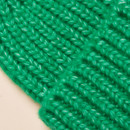 Macro shot of textured green ribbed knit fabric showing yarn detail