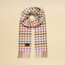 Rectangular wool scarf with multicoloured check pattern in green, tan, pink, and blue, finished with twisted tassel edges.