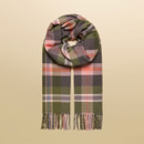 Flat lay of a Joules oversized check scarf featuring navy, pink, red, and olive stripes with fringe detail.
