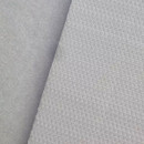 Detailed view of the textured surfaces of hook and loop pads showing the hook and loop fastening system.