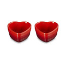 Front view of two Le Creuset Stoneware Heart Ramekins in Cerise, showing their glossy red finish and signature three-ring design.