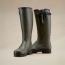 Pair of Le Chameau tall green wellington boots displaying the side profile, adjustable gusset and rugged soles.