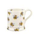A side view of a white ceramic mug featuring a repeating bee pattern with blue wings and yellow bodies, shown against a plain white background.