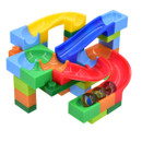 Brightly colored plastic marble run toy with interlocking pieces featuring red, blue, green, yellow tracks and three marbles, creating a playful look.