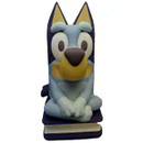 Finished painted Bluey money box figure in blue and yellow tones with friendly expression sitting on a base.