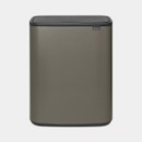 A view of a grey touch lid bin on a white background