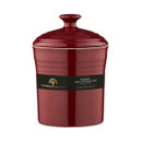 Red ceramic storage jar with a glossy finish and a lid, labelled "Barbary & Oak" in gold text. The jar is elegant and simple, conveying a modern feel.