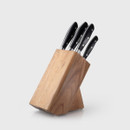 Angled rear view of a five-piece knife block set showing black-handled knives housed in a natural wooden block.
