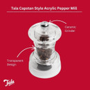 Tala Capstan Style Acrylic Pepper Mill on a red background, labelled with arrows highlighting its ceramic grinder and transparent design.