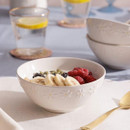 Price & Kensington Daisy bowl filled with fresh fruit and granola, styled on a breakfast table with matching tableware.