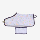 Purple dog coat with orange pony and lemon print, featuring “LeMieux” text. Includes a matching label tag. Cheerful and playful design.