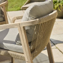 Detailed view of the rope-woven backrest on a wooden garden dining chair, highlighting the textured weave and craftsmanship.