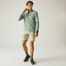 A front view of a man wearing a light sage Regatta fleece on a white background