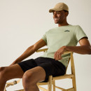 A front view of a man wearing a light sage Regatta t-shirt on a white background