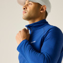 A close up front view of a man wearing a blue half zip Regatta fleece on a white background