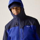 A close up view of a man wearing a blue Regatta waterproof jacket on a white background