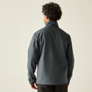 A back view of a man wearing a softshell regatta jacket on a white background