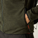 A close up view of a man wearing a dark green full zip Regatta fleece on a white