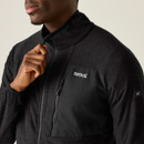 A close up view of a black full zip Regatta fleece on a white background