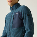 A close up view of a blue Regatta full zip on a white background