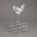 A rustic egg holder with a chicken silhouette on top, displaying three brown eggs in a metal frame against a simple gray background.