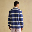 A back view of a man wearing a blue and white striped Joules rugby shirt