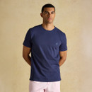 A front view of a man wearing a navy Joules everyday t-shirt