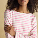 Close-up of a women’s pink and white striped Breton top highlighting the soft cotton fabric and boat neckline.