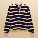 Flat lay of a navy rugby shirt featuring wide pink and white stripes, a white twill collar, pink button placket and embroidered crest.