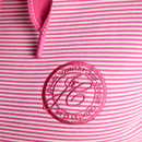 Close-up of the pink embroidered Joules circular chest logo on the striped hoodie.