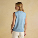 Back view of a women’s sky-blue sleeveless knit vest featuring a ribbed hem and soft wool texture, worn with cream trousers.