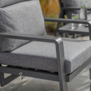 Close-up of anthracite aluminium chair frame and grey seat cushion with adjustable recline mechanism beneath.